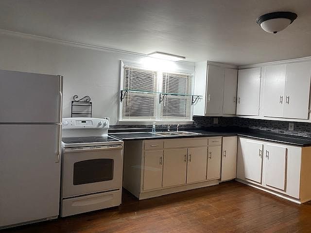 New countertop, backsplash and sink. Stove and fridge are provided. New blinds throughout the house.