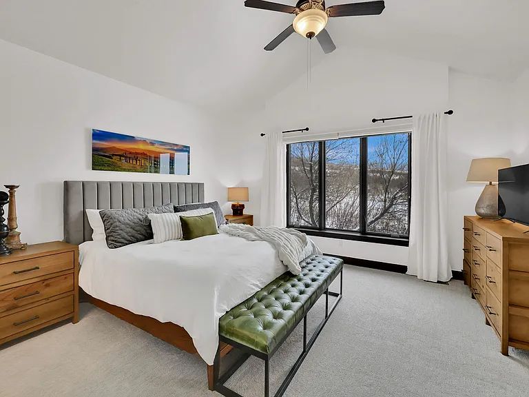 Main floor master bedroom with large closet, and master bathroom with large windows and lots of natural light