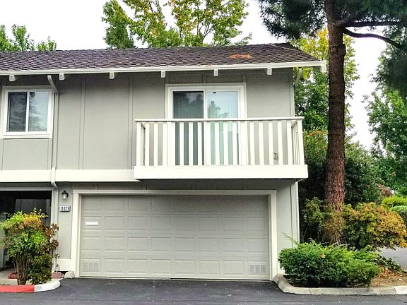 End-unit entrance with attached 2 car garage