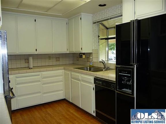 The kitchen has numerous cabinets, laminate flooring. It is galley style so very easy to work in.