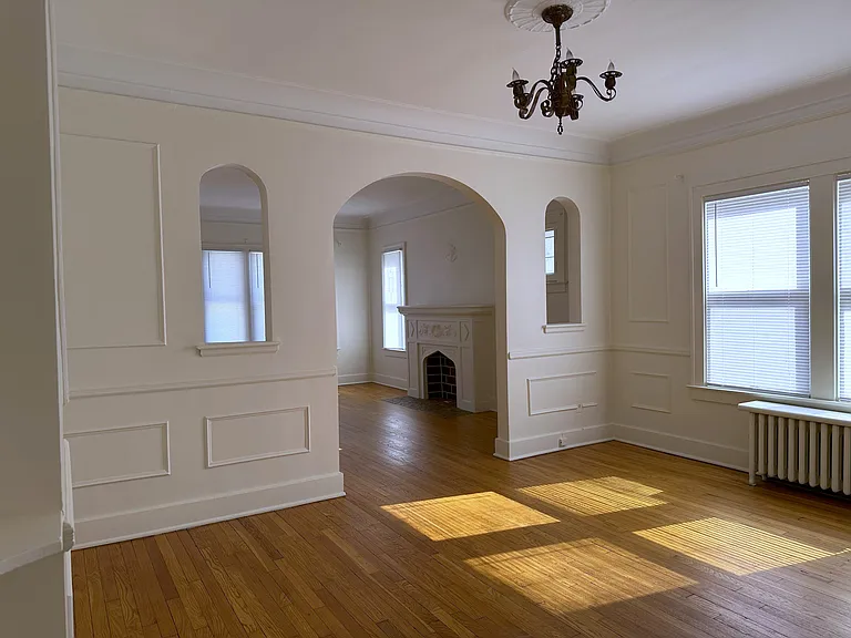 Large dining room will cove ceilings and original woodwork.