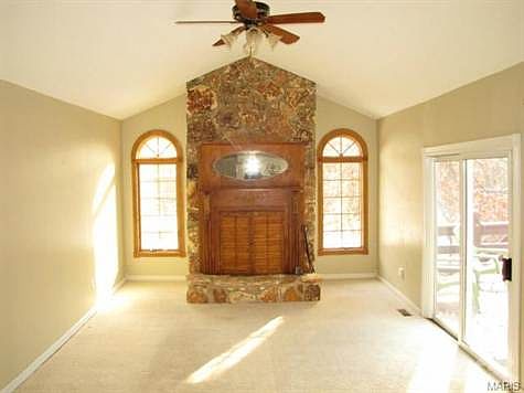 Hearth room with custom mantle, walks out to deck.