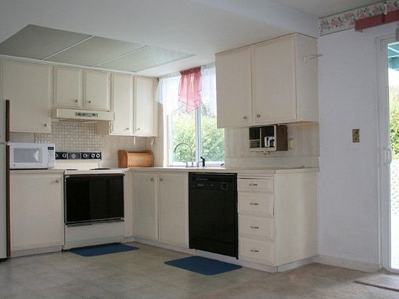 The Kitchen includes the dishwasher, microwave, stove and refrigerator. From the Kitchen window you 