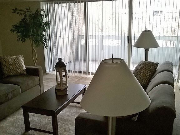 Large, Bright Living Room With Beautiful Balcony View.
