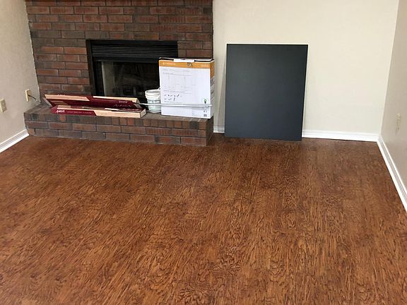 living room with wood burning fireplace