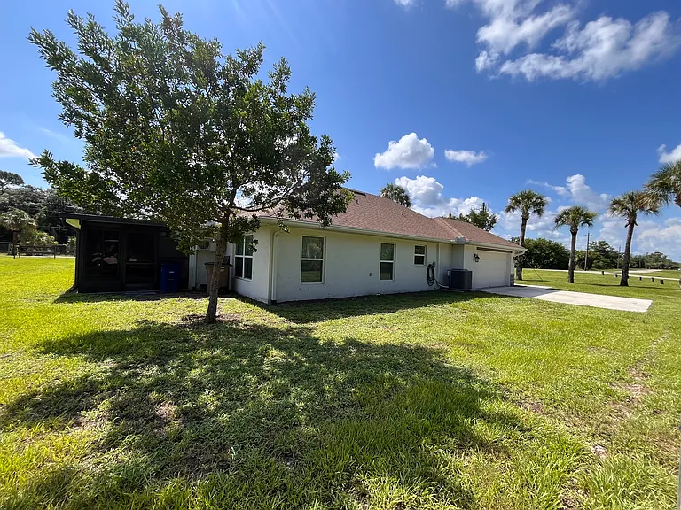 West side of House, 2 car garage