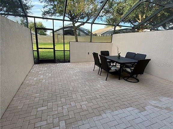 Screened-in patio. Private backyard.