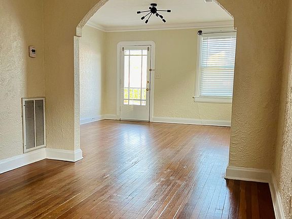 view of living room with the front door closed from the dining room
