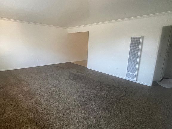 Living room with view leading to kitchen
