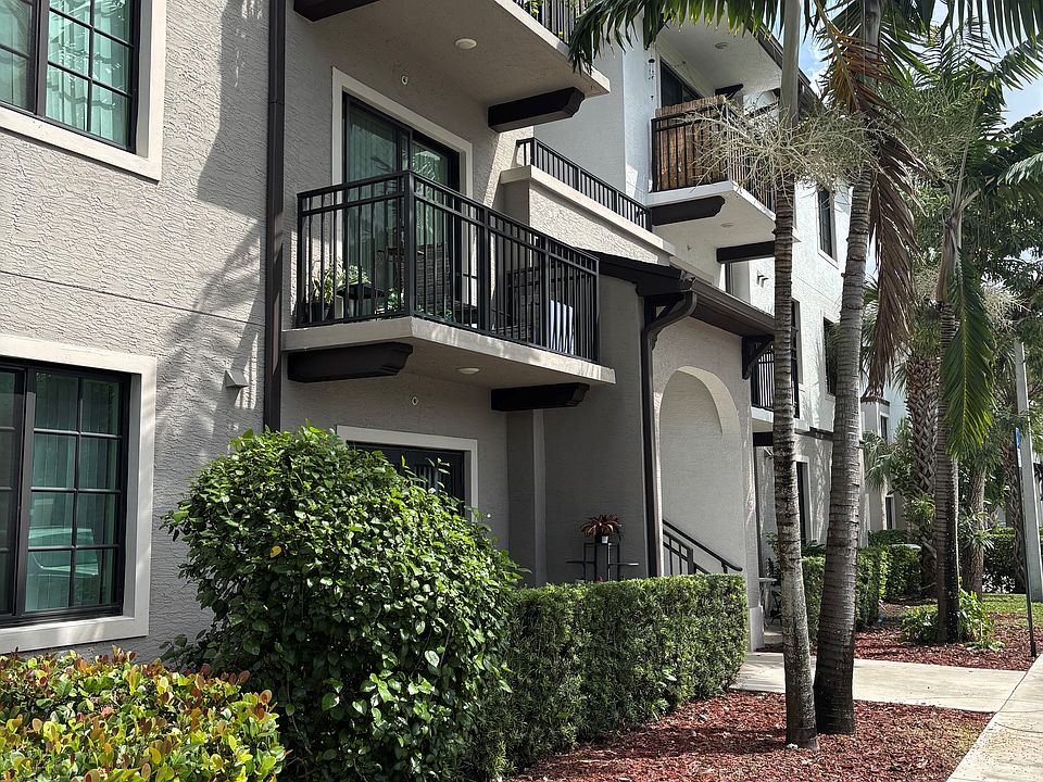 Private balcony with serene views and lush landscaping. Perfect for relaxing outdoors.