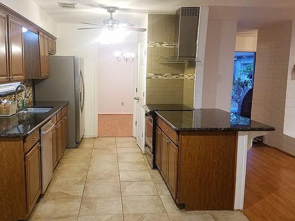 Granite Counter tops and Under mount Stainless steel double sink. Cook top and Oven. Stainless Steel Appliances. Refrigerator stays unless you have your own and we can move it out.
