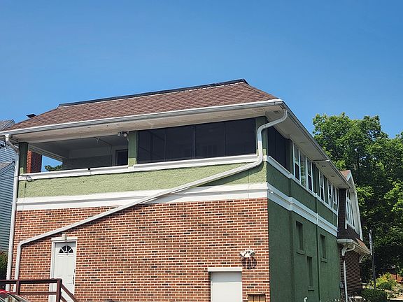 View of screen porch and back of apartment (second floor)