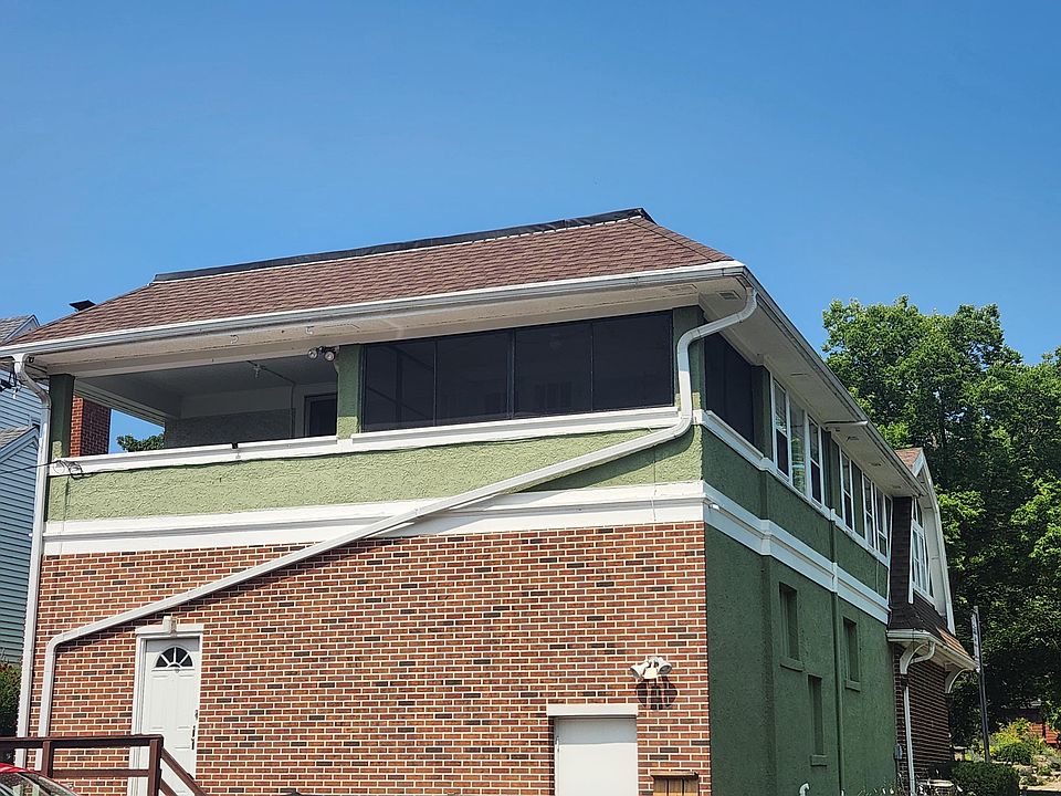 View of screen porch and back of apartment (second floor)