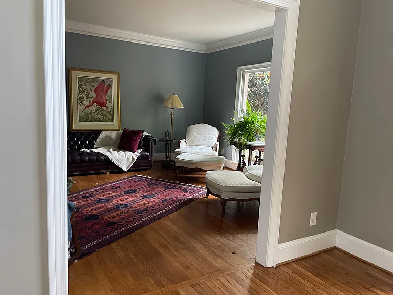 View in to living room. This is off foyer and connects to family room with double doors. These glass panel doors offers the possibility of friendly separation during a boisterous gather!