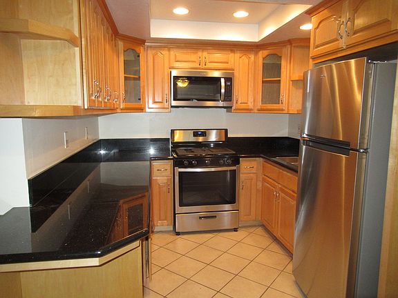 KITCHEN: MICROWAVE, DISHWASHER, RANGE AND REFRIGERATOR INCLUDED IN LEASE.