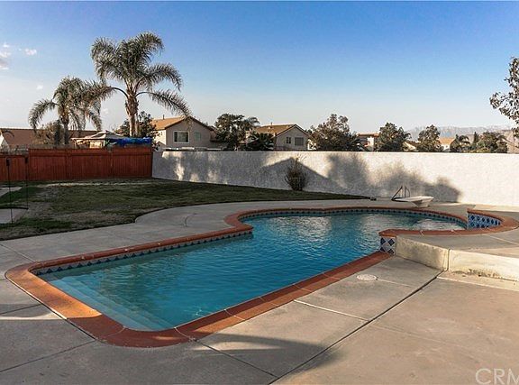 Pool with step entry and diving board