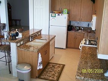 Side View of Granite Tops in Kitchen and GE Appliance Package