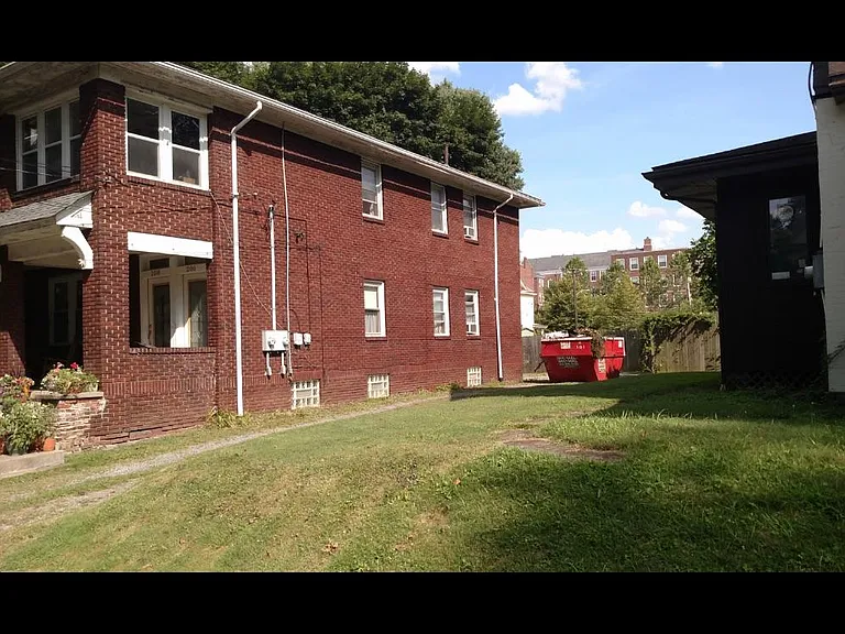 Side of entire building with long driveway