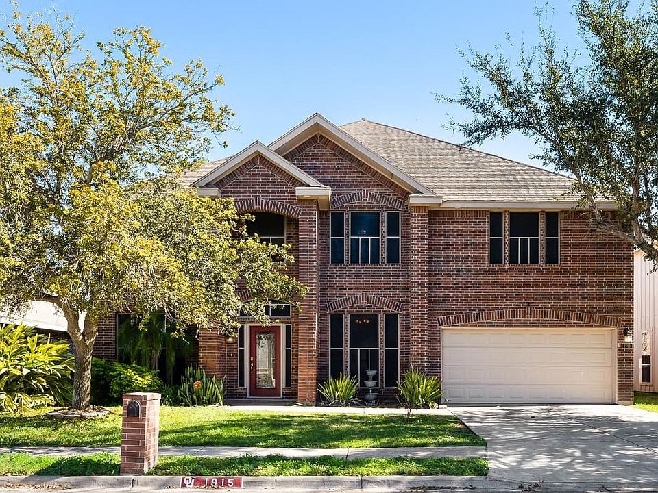The front of the house is not only stylish but also energy-efficient, with solar screens on every window, providing added privacy, reducing glare, and helping to keep your home cool and comfortable year-