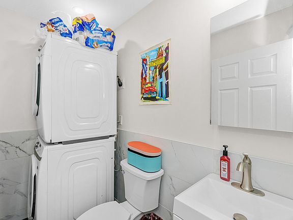 Half bath with washer and dryer.