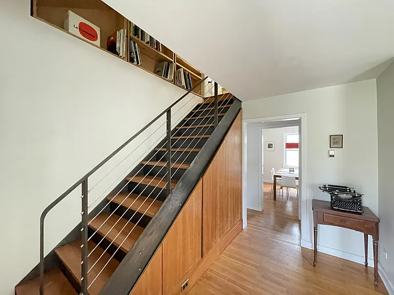 Stair to Primary Bedroom Suite and bonus room (bonus room not pictured). Dining Room is beyond.