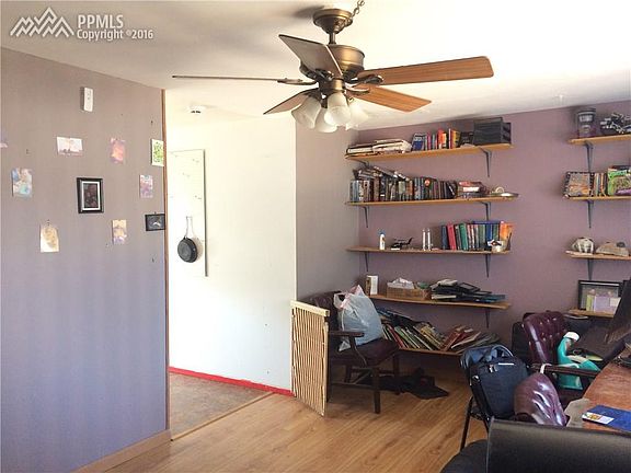 Living room view from front door. Looking into the kitchen.