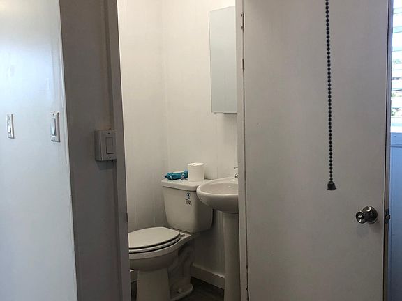 New toilet, sink, cupboard. Built in ventilator in bathroom.