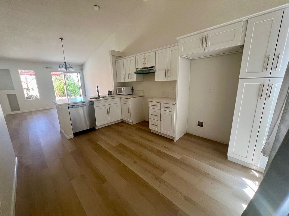 Freshly renovated kitchen with dishwasher and plenty of cabinet storage.