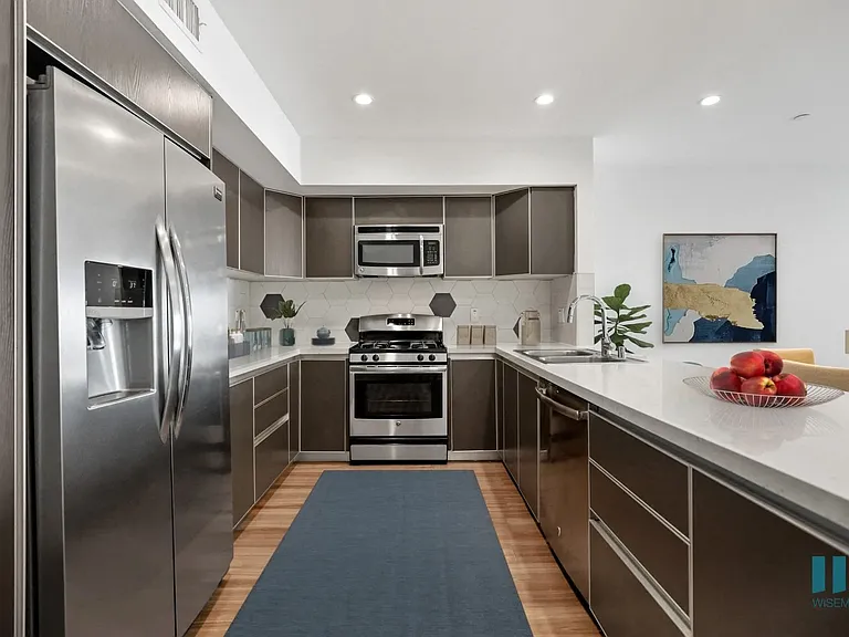 Full-Size Kitchen with Stainless-Steel Appliances and Ample Cabinet Storage