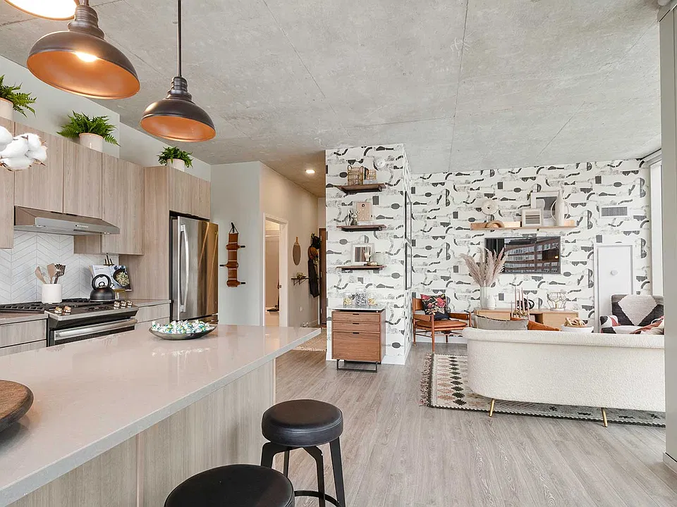 A seamless kitchen and living area creates an inviting space for everything from quiet mornings to nights spent entertaining.