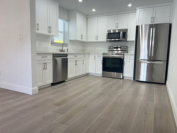 Kitchen. All rooms have cordless window treatments.