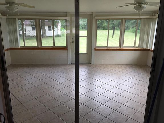 Air conditioned tiled Florida room. Large shed in the back yard with power.