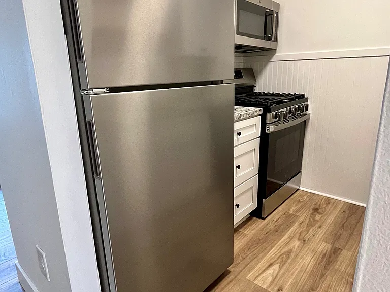 Brands new gas range, microwave, dishwasher, and full-size refrigerator