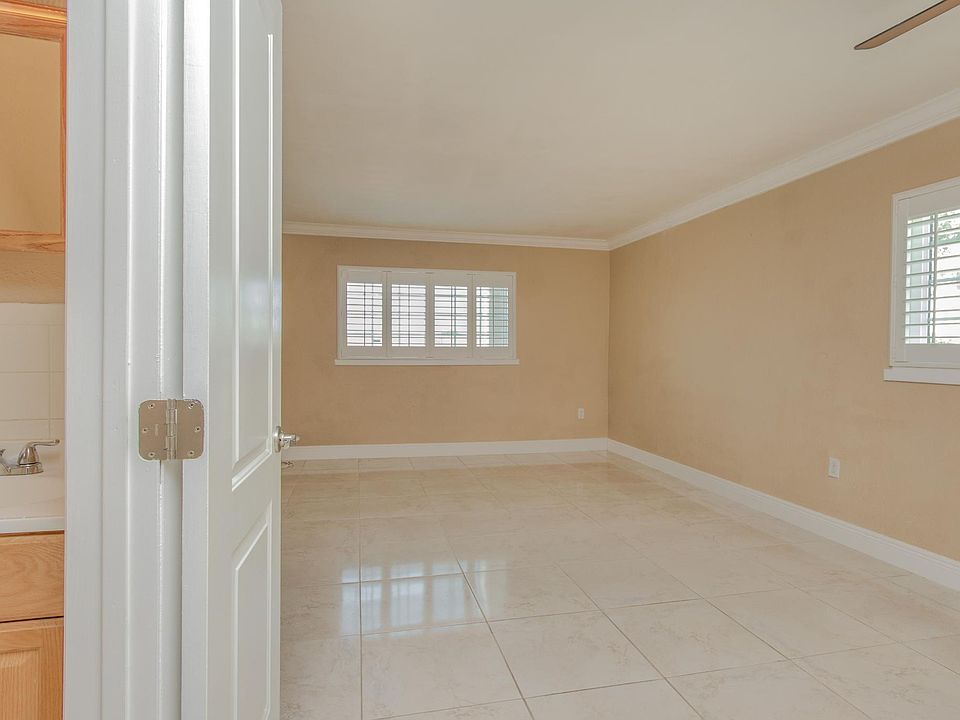Downstairs Living Room: Corner unit with two large windows means tons of bright light.