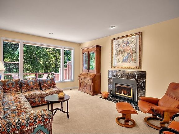 Open and light with a fireplace. Greenbelt views.