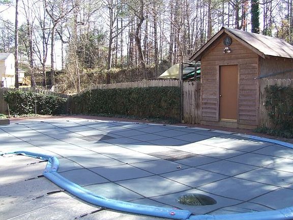 In-ground pool in private fenced yard