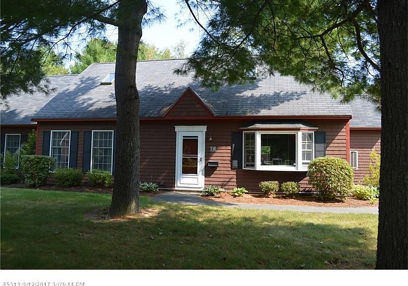 End unit with double driveway.