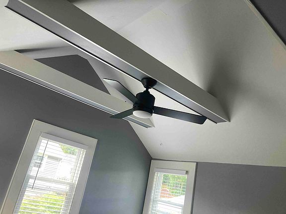 Vaulted ceiling and fan in living room