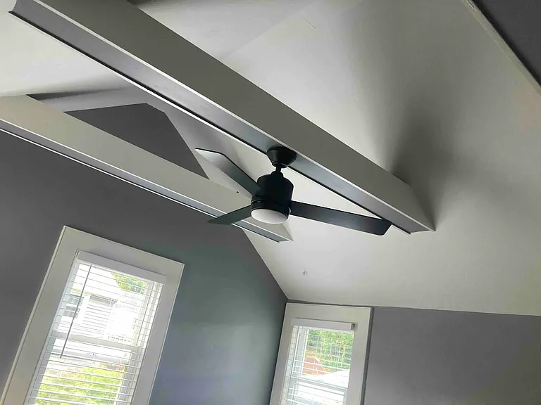 Vaulted ceiling and fan in living room