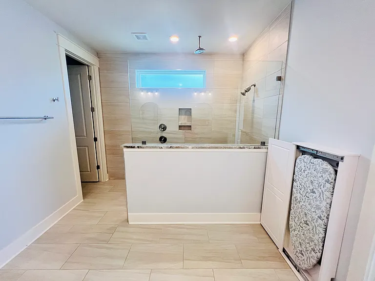 Beautiful master bathroom with iron stand and elegant finishes