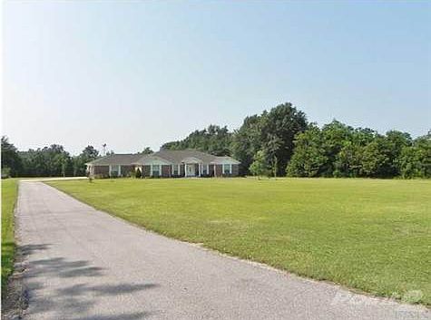 Long driveway that takes you to Spacious Side entry 2 Car Garage.
