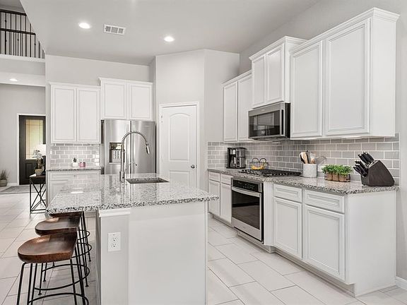 The home was completed in June 2020 and has all the bells and whistles you need. Look at this dream kitchen!