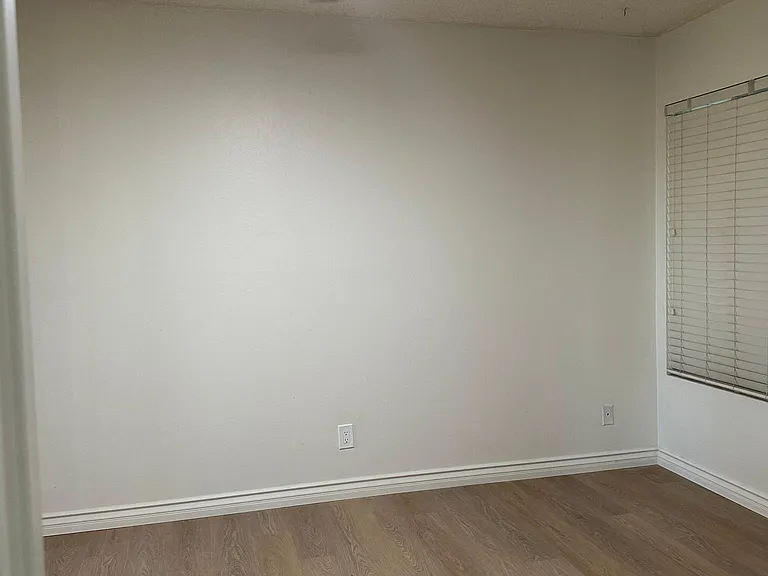 2nd bedroom with modern remote controlled ceiling light and fan
