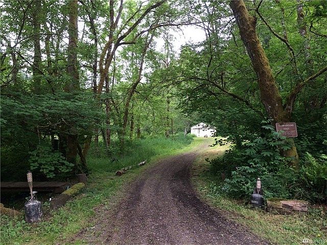 Looking up driveway to poleb