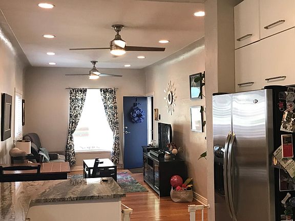 Kitchen with farm sink, new granite counters, and updated appliances.