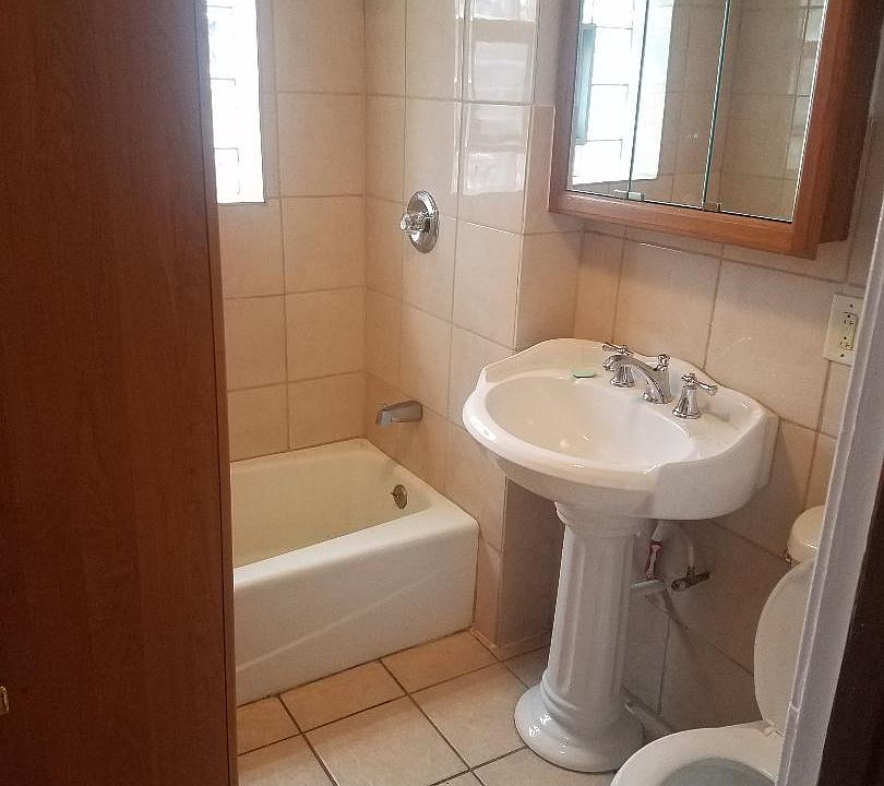 Bathroom with cabinet before remodeling