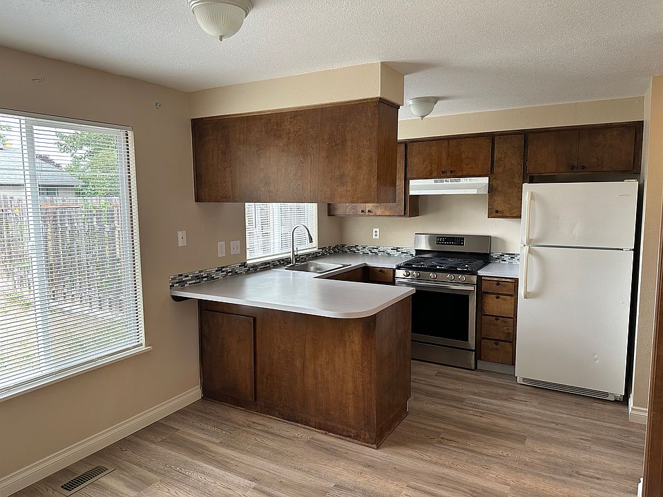 Kitchen with gas stove, refrigerator, and dishwasher
