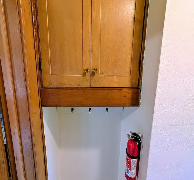 [BOTH UNITS]: mud space and storage outside back entryway to units