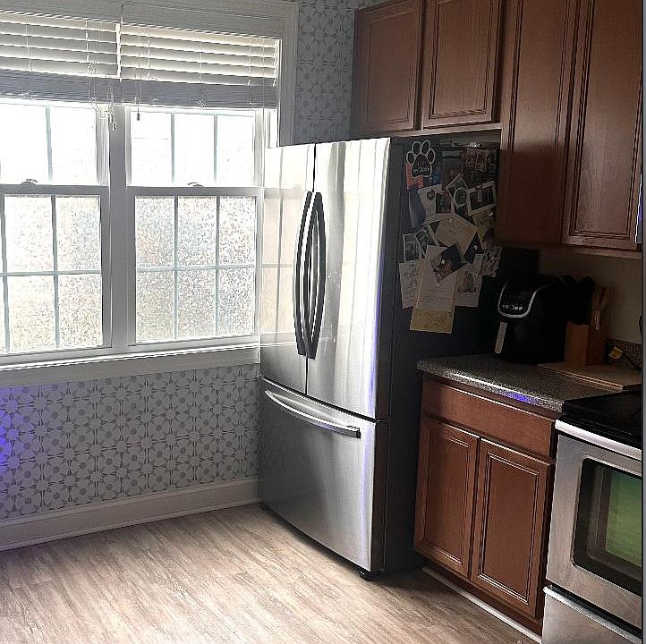NEW HUGE FRIDGE and MICROWAVE! 

Also: Our recent tenants added fun decals to the windows that provide privacy, and some more decal/wallpaper to accent one kitchen wall and a couple of the bathroom walls (and the stairwell)... we love the look, so we ask