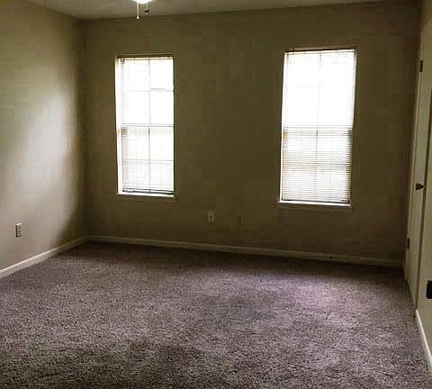 Downstairs bedroom beside a full bath